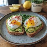 Best Avocado Toast with Poached Eggs featuring creamy avocado, runny poached eggs, and fresh herbs on whole grain toast.
