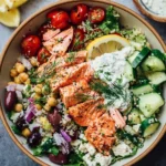 Mediterranean Bowl with grilled salmon, fresh veggies, and vibrant flavors.