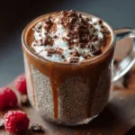 Delicious mocha chia pudding topped with cocoa and chia seeds in a glass bowl