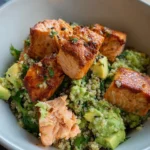 Delicious Salmon Quinoa Bowl with Lemon Feta Avocado Salsa